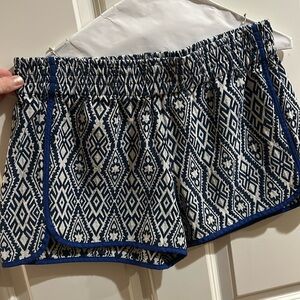 WAI size XL elastic waist shorts trimmed in royal blue with an inner back pocket
